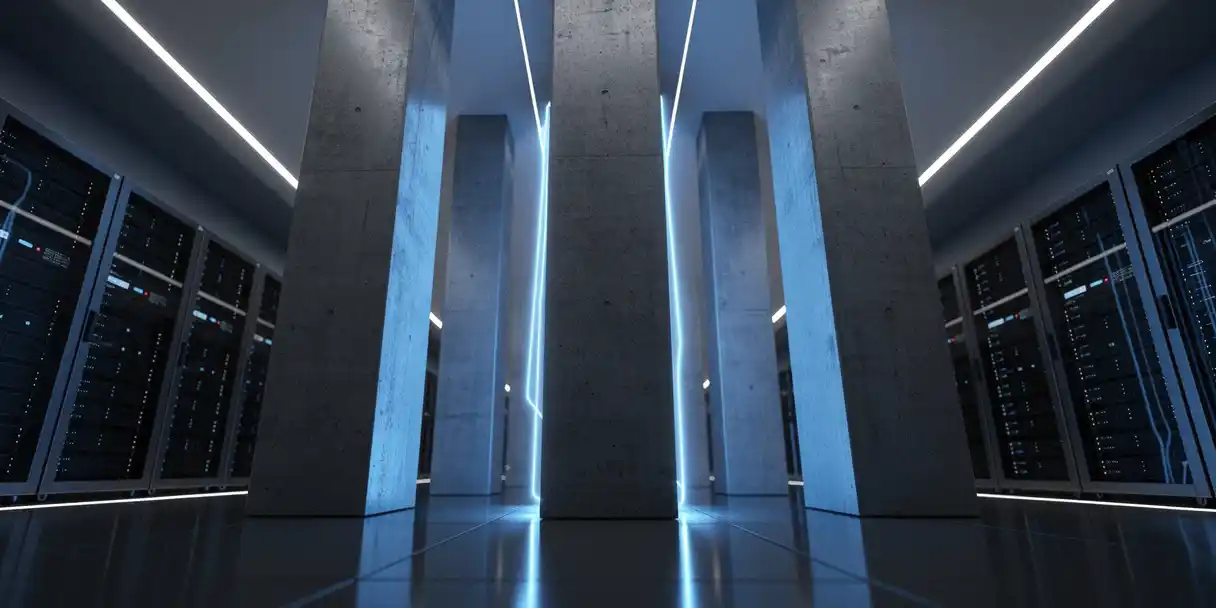 Concrete pillars in a modern server room corridor bathed in cool blue ambient light, emphasizing digital infrastructure and enterprise scale.